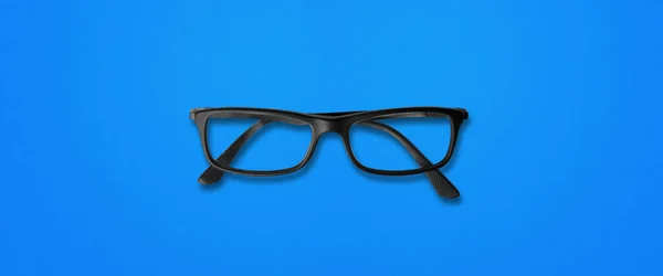 Lunettes Yeux Noirs Isolées Sur Fond Bleu Bannière — Photo