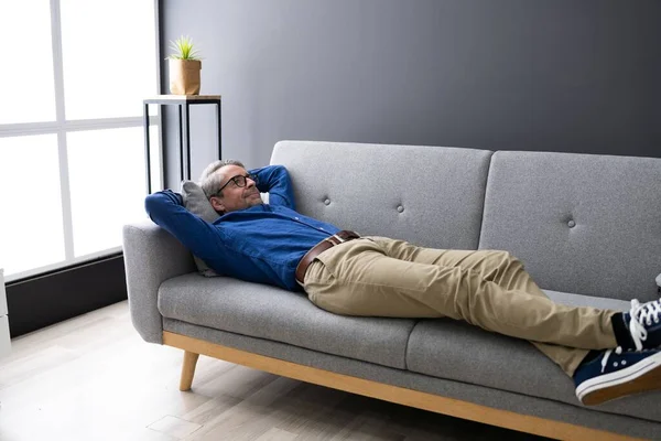 Senior Man Relaxing Sofa Living Room — Stok Foto