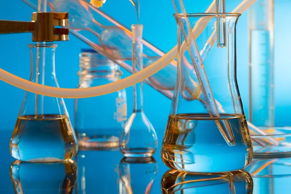 Laboratory Glassware Liquid Blue Background — Stock Photo, Image