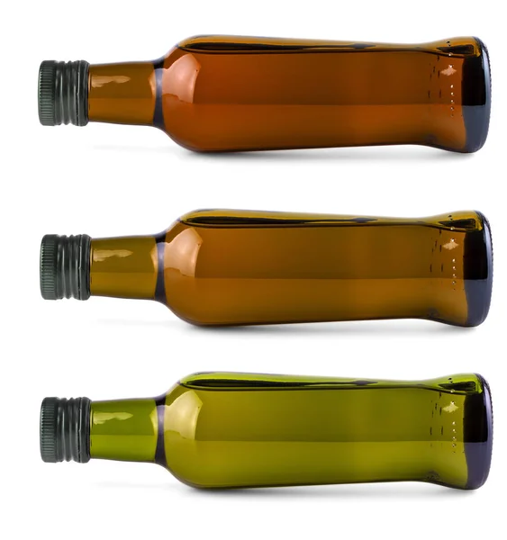 躺在旁边的绿色瓶子上 上面涂满了橄榄油 — 图库照片