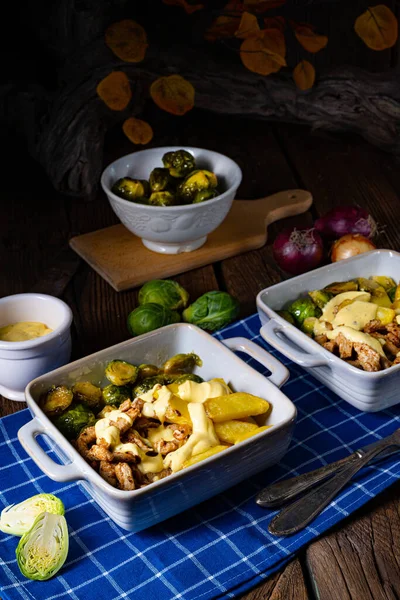 Gratinated Zurich ragout with Brussels sprouts, potatoes and Bearnaise sauce