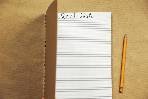 Open Notebook Writing 2021 New Year Goals Close Brown Background — Stock Photo, Image