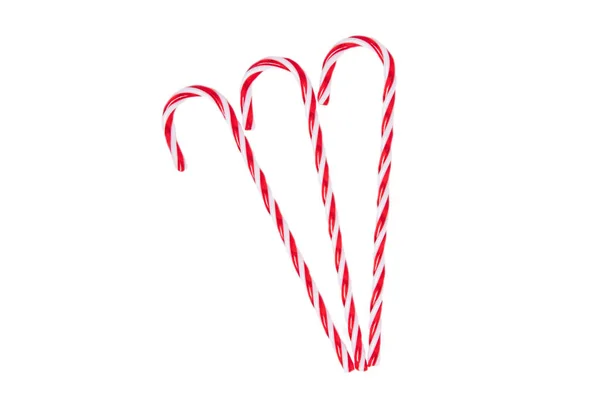 ペストリー デザート お菓子 白い背景に隔離された伝統的なクリスマスの赤と白の縞模様のキャンディーの杖 トップ表示 — ストック写真