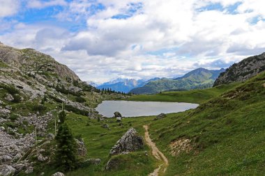 Lake Valparola in the Dolomites in South Tyrol. A mountain lake on the Valparola Pass in the Italian Alps clipart