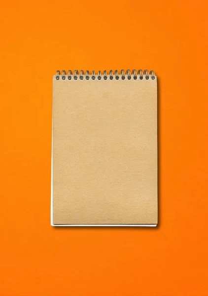 Spiral Closed Notebook Mockup Brown Paper Cover Isolated Orange Background — Stock fotografie