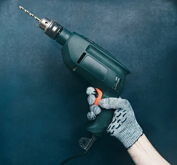 Green Drill Hand Builder Blue Background Shallow Depth Sharpness Concept — Stock Photo, Image