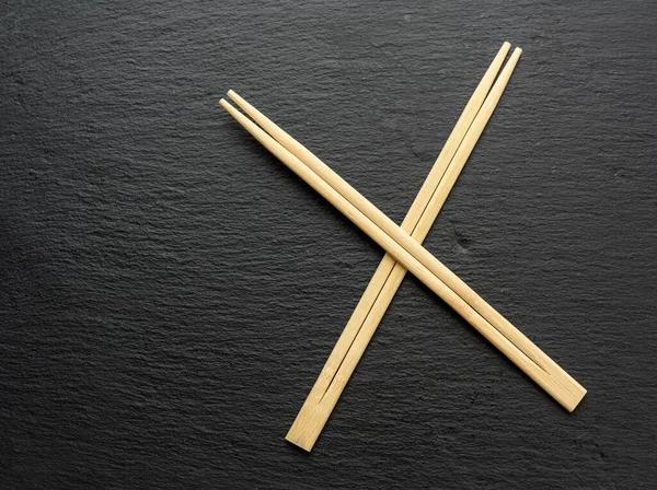 Two Wooden Sticks Sushi Black Background Top View — Stock Photo, Image