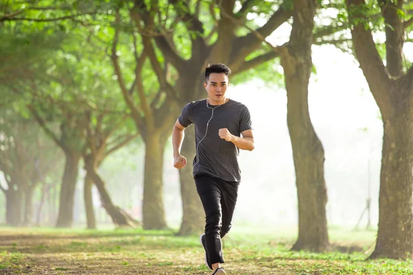 Asian Young Man Running Forest Foggy Morning — Stock Photo, Image
