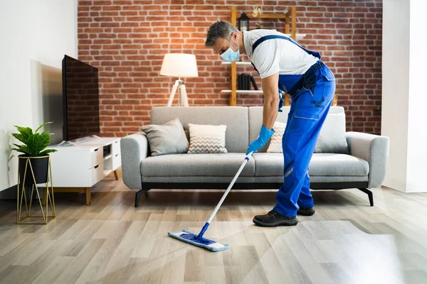 Man Cleaning Hardwood Floor Mop Face Mask — Stok Foto