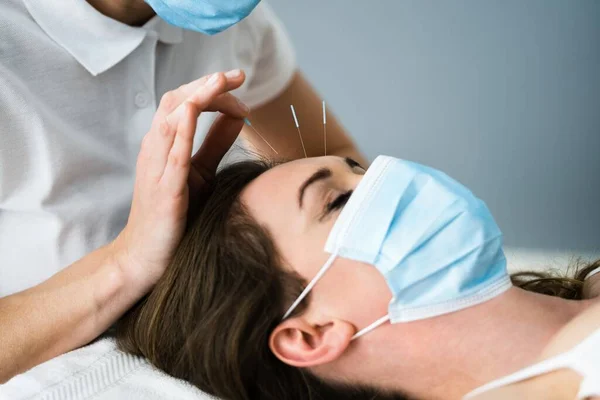 Acupuncture Woman Face Close Up In Face Mask