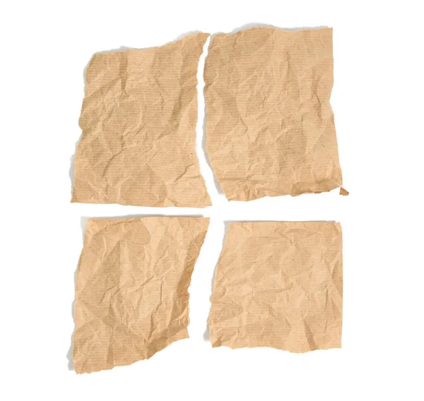 Cztery Podarte Kawałki Brązowego Papieru Kraft Izolowane Białym Tle Widok — Zdjęcie stockowe