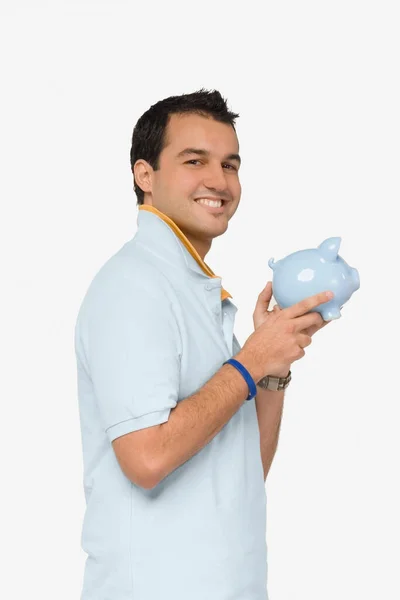 Portret Van Een Jonge Man Met Een Piggy Bank — Stockfoto