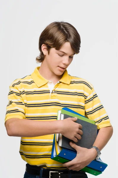 白色背景上的书的年轻学生 — 图库照片