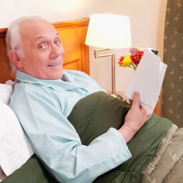 Senior Man Reading Book His Bedroom — Stock Photo, Image