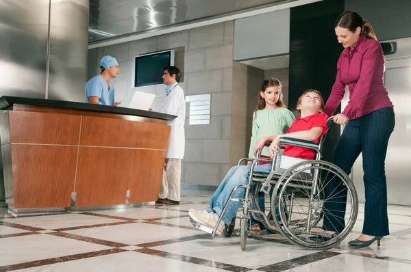 Disabled Man Woman Wheelchair Her Son Hospital — Stock Photo, Image