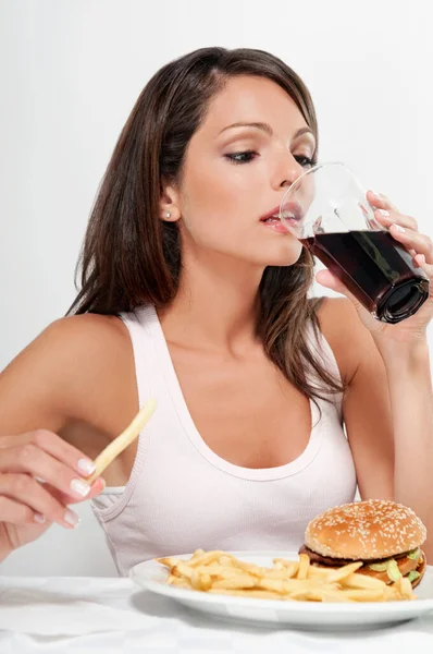 Young Woman Eating Burger Drinking Beer Home — Stock Photo, Image