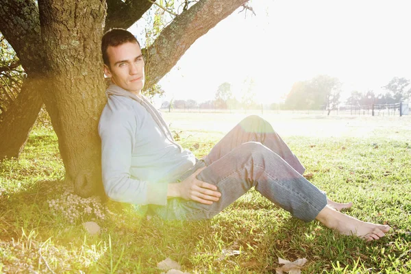 Young Man Sitting Grass Looking Camera — Stock Photo, Image