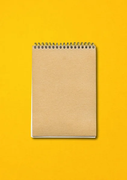 Spiral Closed Notebook Mockup Brown Paper Cover Isolated Yellow Background — Stock Photo, Image