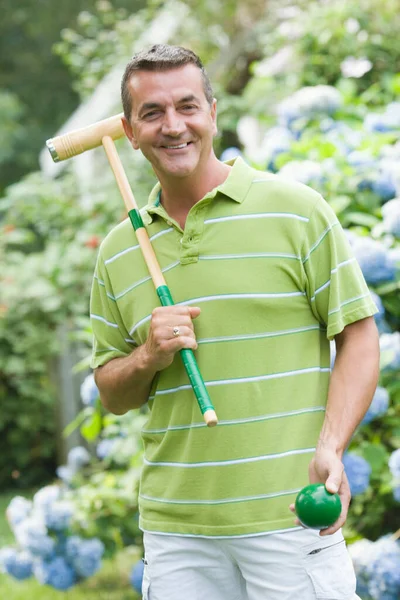 Portrait Mature Man Holding Croquet Mallet Ball Smiling Stock Image