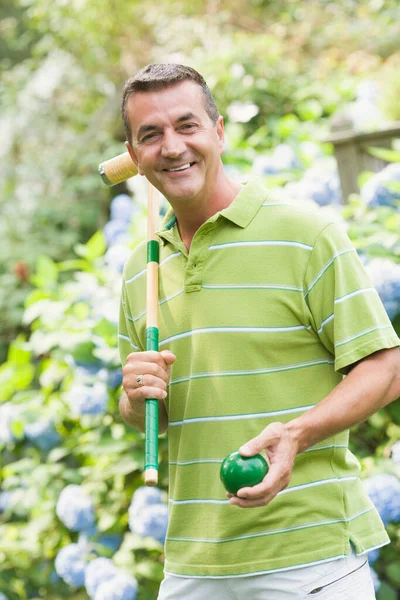 Portrait Mature Man Holding Croquet Mallet Ball Smiling Royalty Free Stock Images