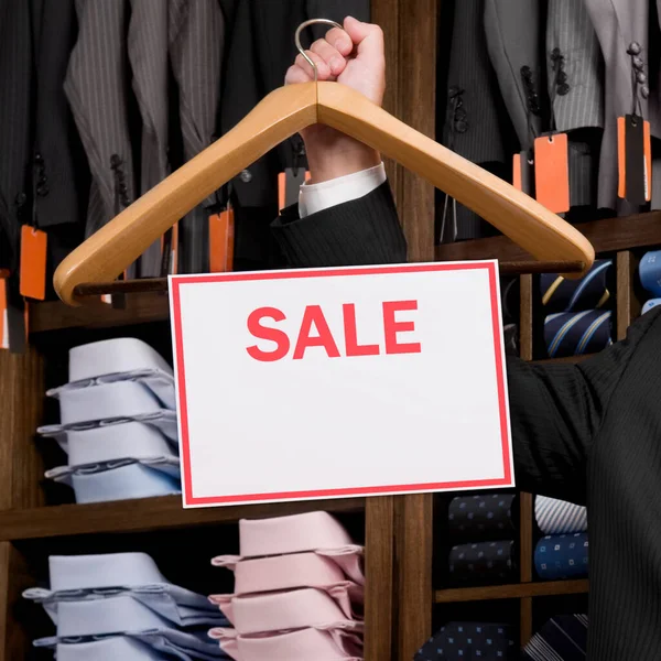 Man Holding Red Shopping Bag Wooden Sign — Stock Photo, Image