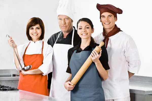 Group Happy Young People Standing Kitchen Smiling — Stock Photo, Image