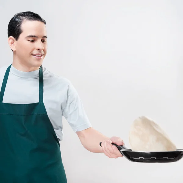 Joven Delantal Sosteniendo Una Bandeja Con Una Espátula —  Fotos de Stock