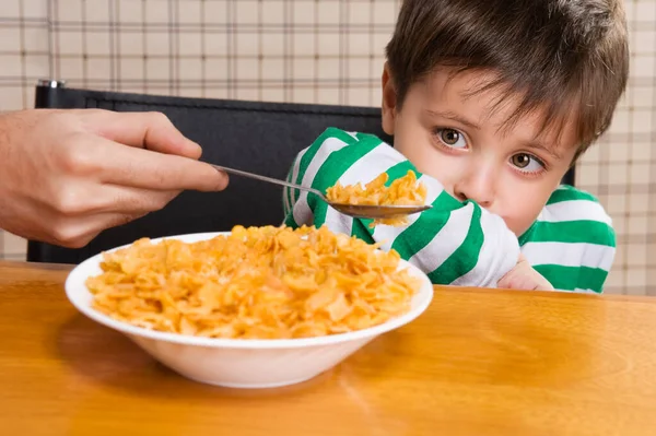 Little Boy Eating Pasta Sausage Corn — Stock Photo, Image