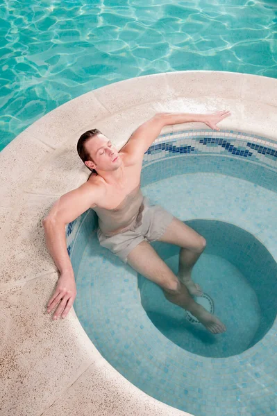 young man in the pool