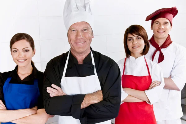 Group Professional Chefs Uniform Arms Crossed Smiling Camera — Stock Photo, Image