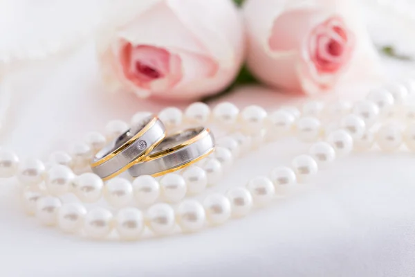 Modern Wedding Rings Pearl Necklace Wih Pink Roses Background Soft Stock Image