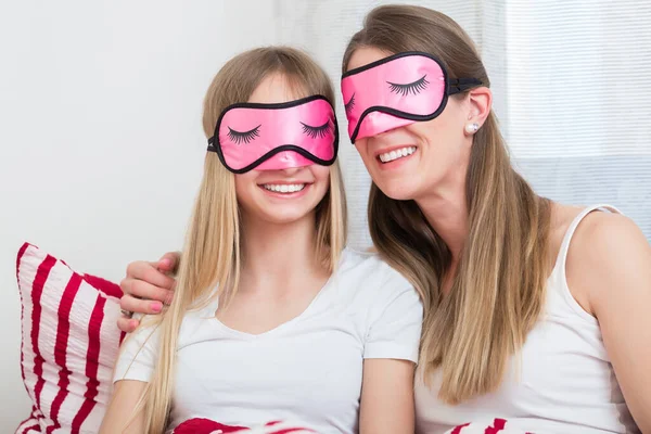 Mother Daughter Wearing Pink Sleeping Masks Bed — Stock Photo, Image