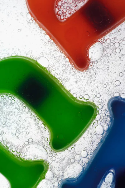 Close Plastic Alphabets Glass Water — Stock Photo, Image
