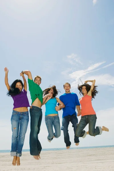 Portrait Five Young People Jumping Beach — Stock Photo, Image