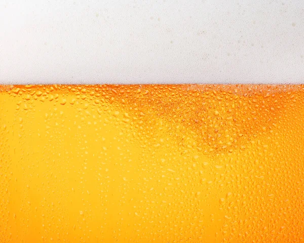 Zamknij Tło Tekstury Wylewania Piwa Lager Bąbelkami Pianą Mroźnym Szkle — Zdjęcie stockowe