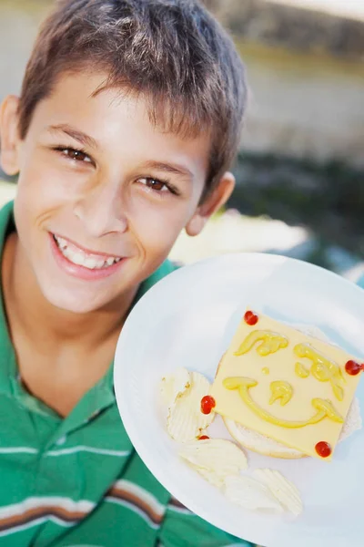 Portrait Teenage Boy Showing Smiley Face Slice Cheese Plate — Stock Photo, Image