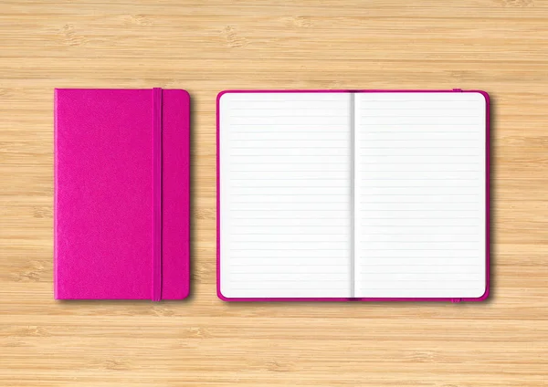 粉红色 闭合和开放的内衬笔记本 独立于木制背景 — 图库照片