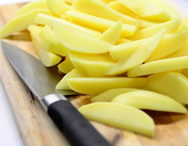 Heap Cut Raw Potatoes Slices Wooden Plate Chef Knife — Stock Photo, Image