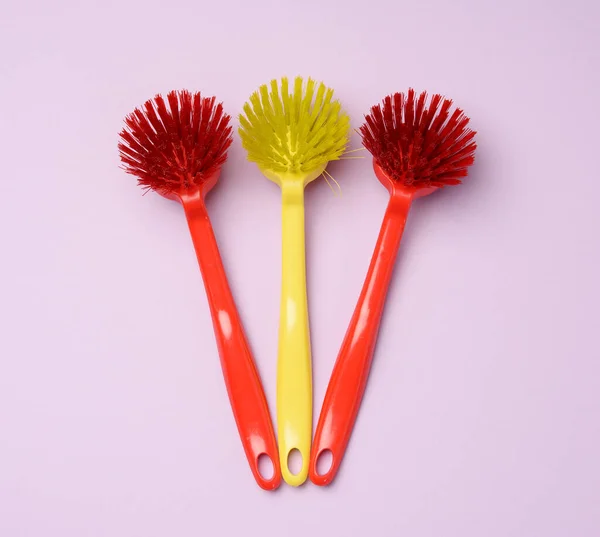 Plastic Brushes Handles Cleaning Lilac Background Top View — Stock Photo, Image