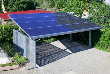 New carport with semi transparent photovoltaik moduls clipart