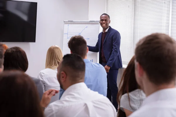 Portrait Handsome Young Businessman Giving Presentation His Colleagues Sitting Chair — Stock Photo, Image