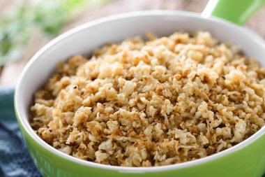 Fresh homemade roasted or fried cauliflower rice in bowl (Selective Focus, Focus one third into the bowl) clipart