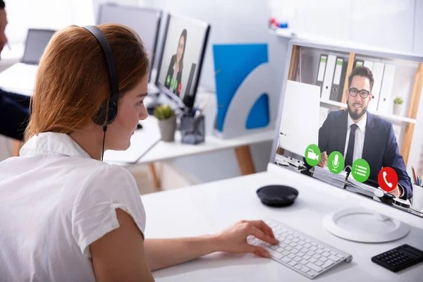 Close Businesswoman Video Conferencing Her Male Colleague Computer Workplace — 스톡 사진