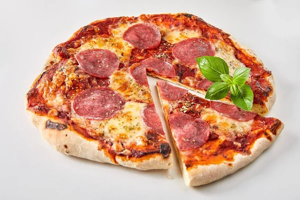 Sliced Italian Salami Pizza Garnished Fresh Basil White Background Advertising — Stock Photo, Image
