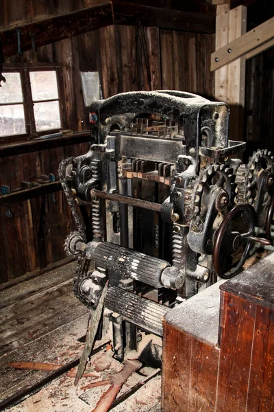 a machine for sawing wood logs out of tree trunks