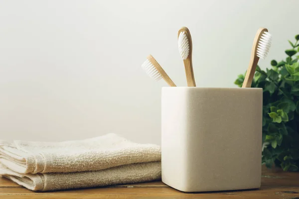 Three Bamboo Toothbrushes Glass Plant Towerls Background Environmental Awareness Oral — Stock Photo, Image