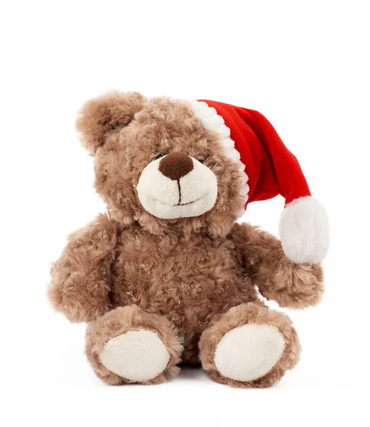 Kleiner Niedlicher Brauner Teddybär Mit Rotem Weihnachtsmütze Sitzt Auf Isoliertem — Stockfoto