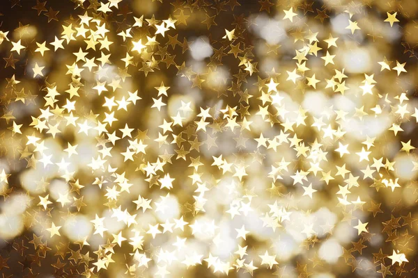 暗い背景に金色の星とクリスマスの背景 — ストック写真
