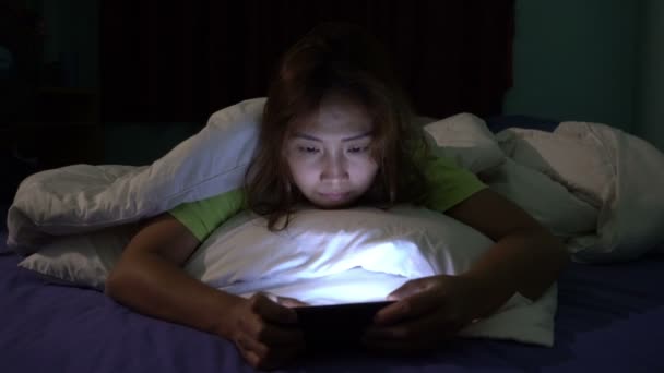 Asian Woman Playing Game Smartphone Bed Night — Stock Video