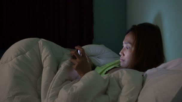 Asian Woman Playing Game Smartphone Bed Night — Stock Video